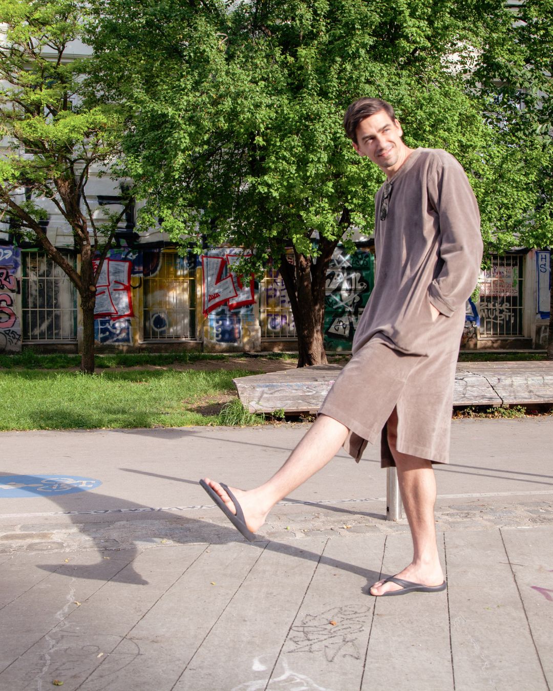 Man wearing Sonus Aeris unisex one-piece in the city park